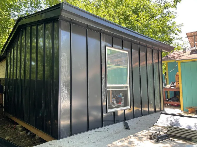 Black standing seam metal wall panels for Roof Inspection in Hockinson